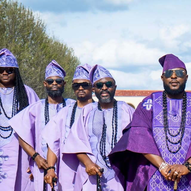Nigerian wedding portrait, groom in lavender agbada